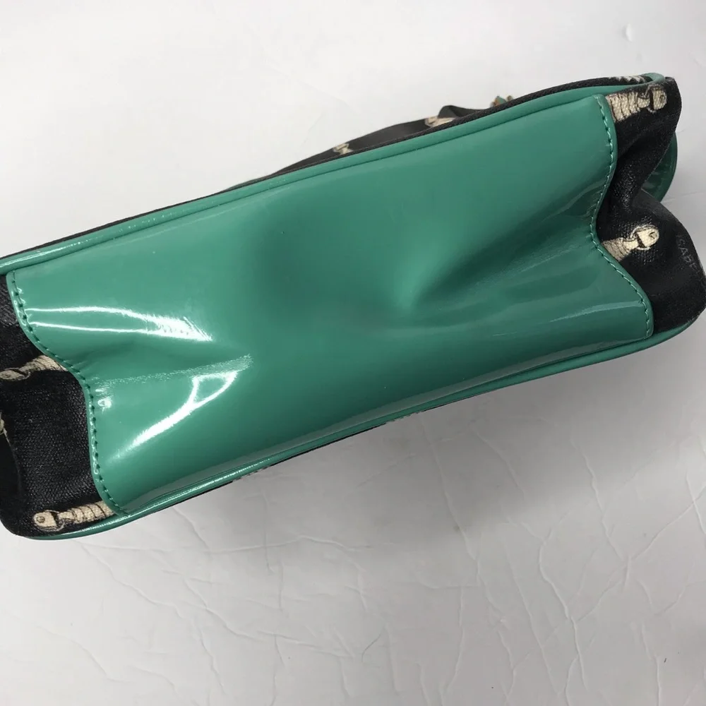 Isabella Fiore black and teal tassels make up bag